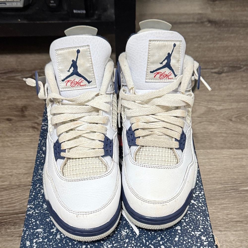 Nike Air Jordan 4 White and Navy Sneakers